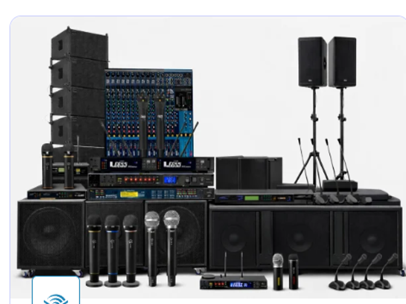 Professional audio solutions setup with speakers, microphones, a mixer, and sound system equipment